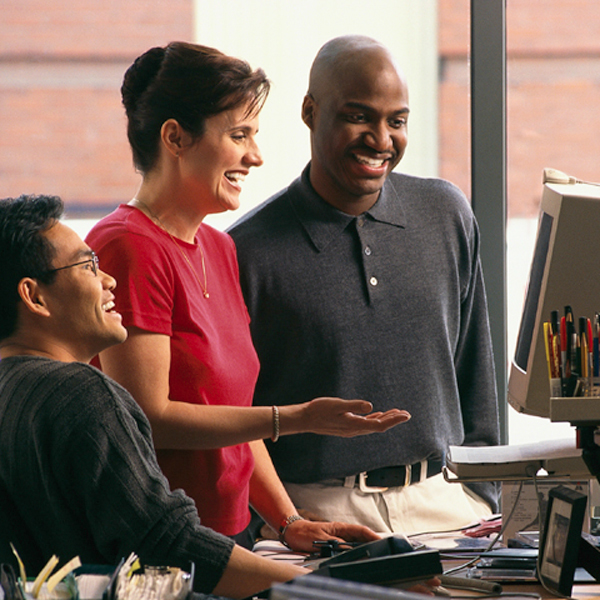 3 people around a computer pic
